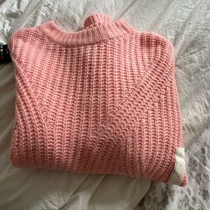 A pink knitted sweater, from target and size medium